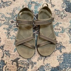 Gray teva strap sandals.